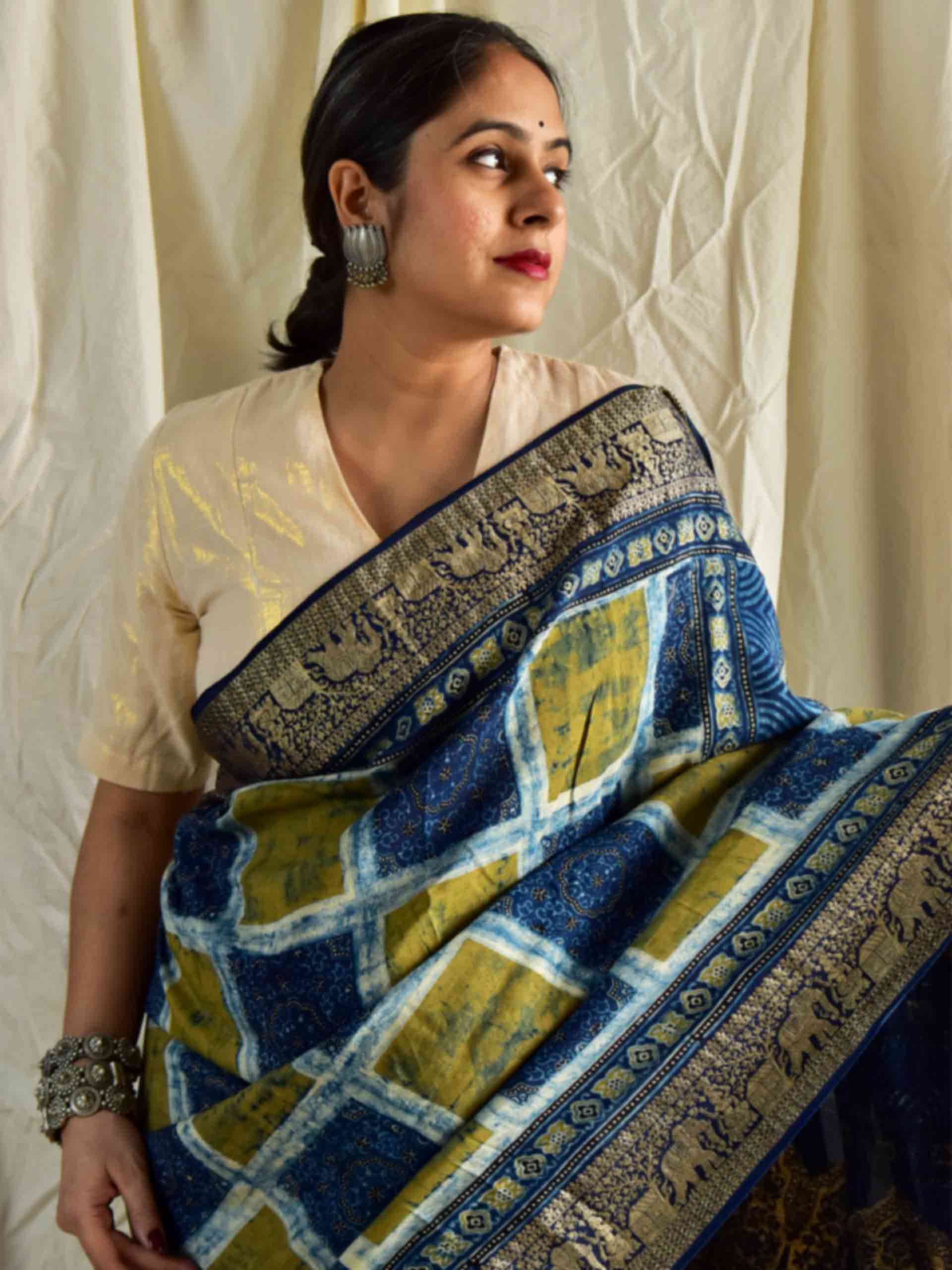 Gur laddo - Ajrakh hand block printed Dola Silk zari border Saree
