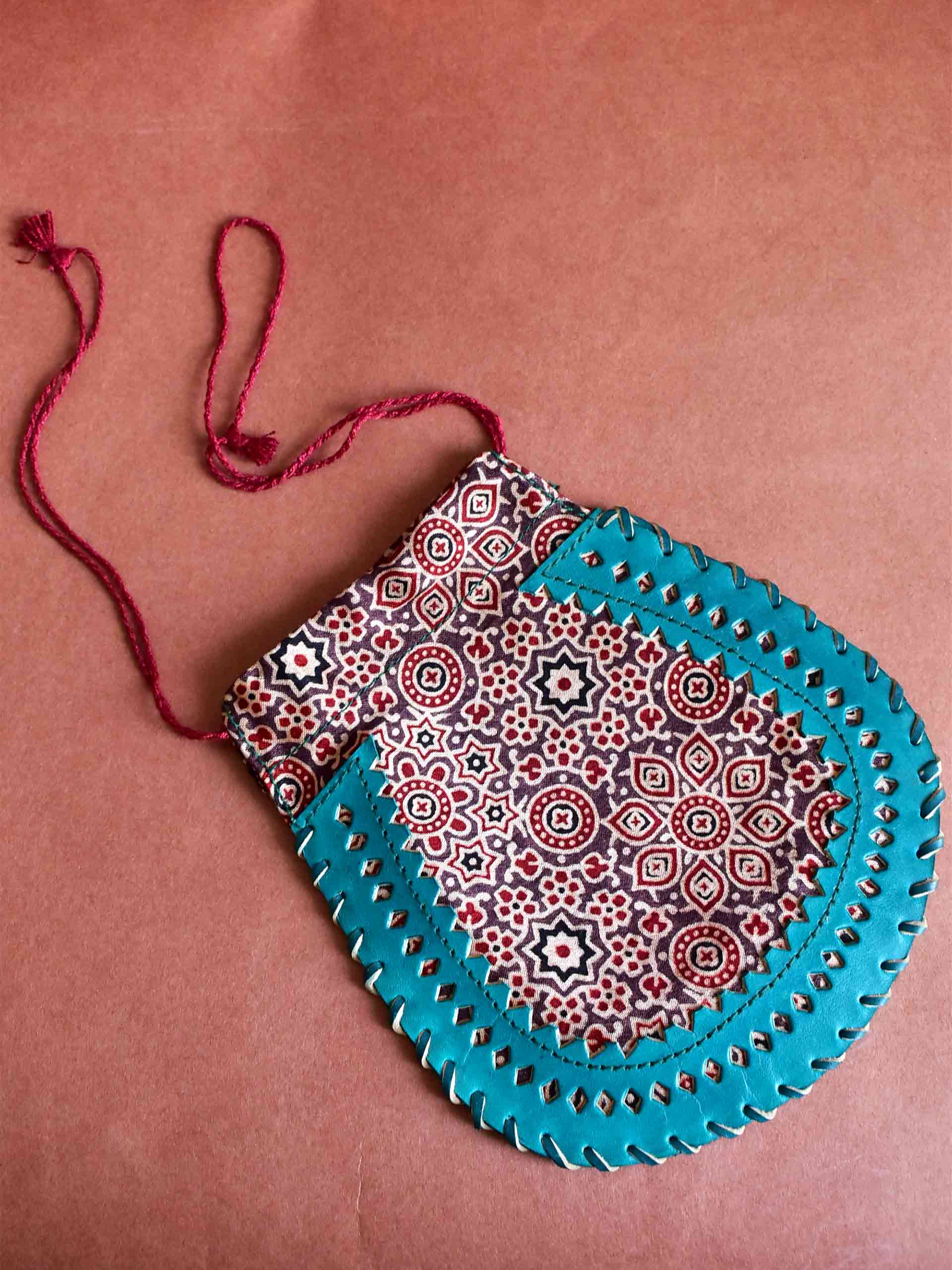 Earthy rhythm - mashru silk and leather coin potli