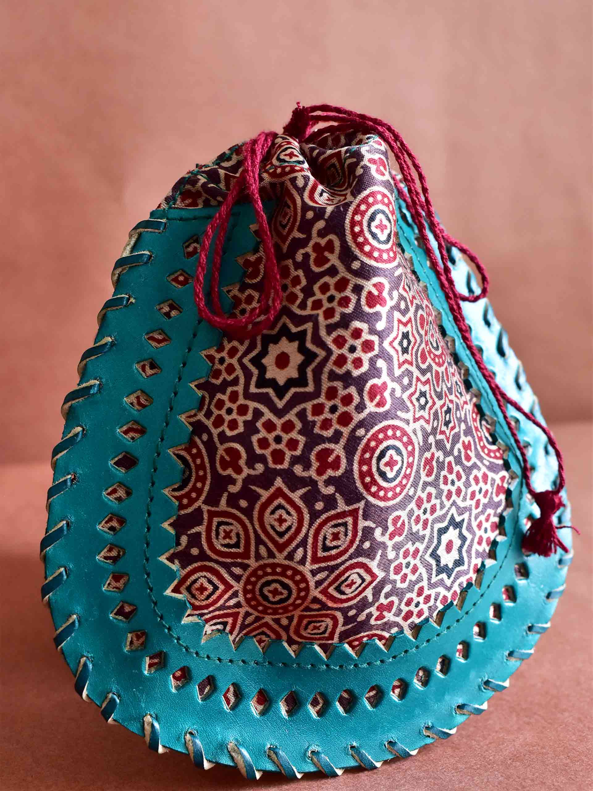Earthy rhythm - mashru silk and leather coin potli
