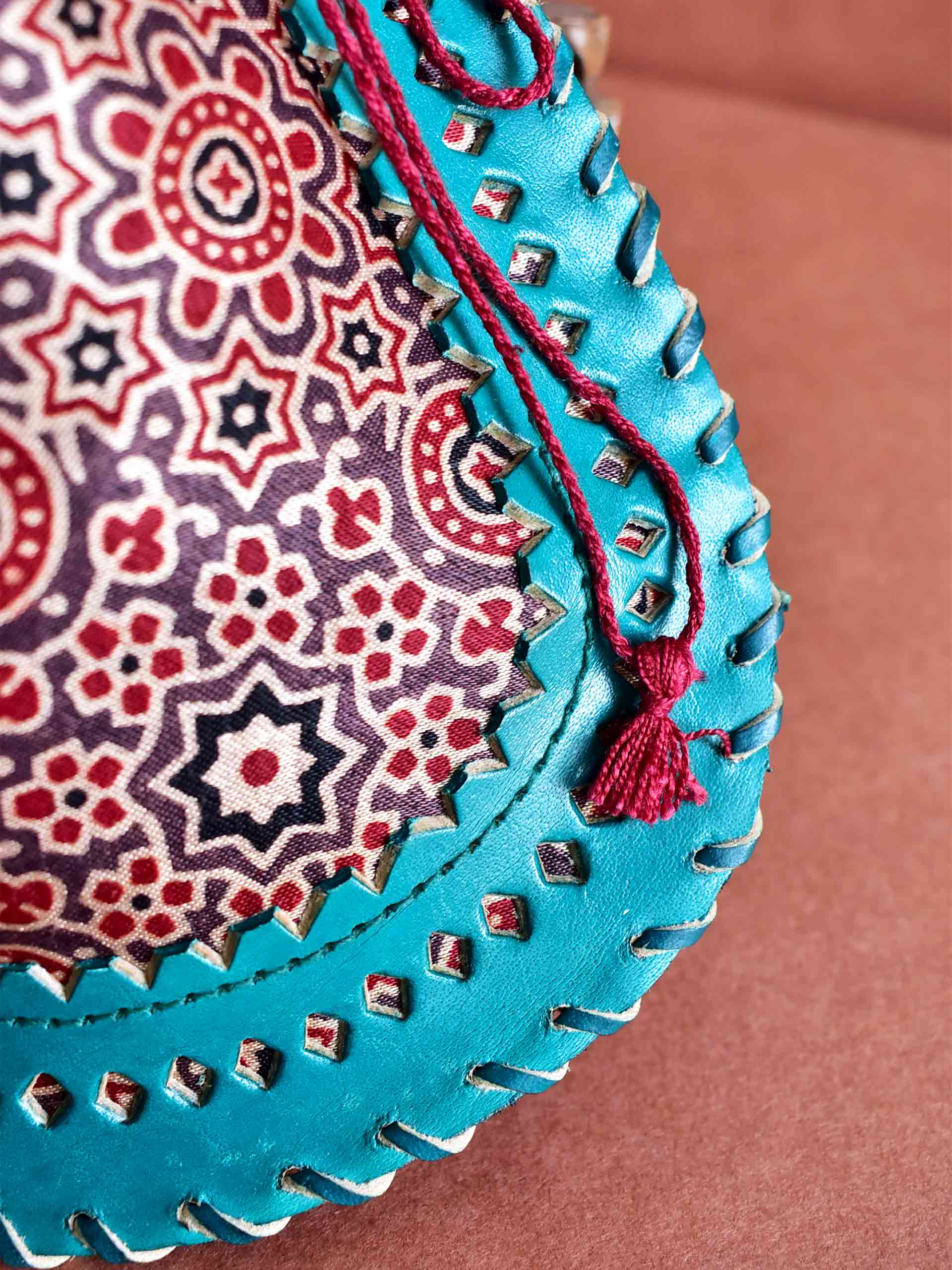 Earthy rhythm - mashru silk and leather coin potli