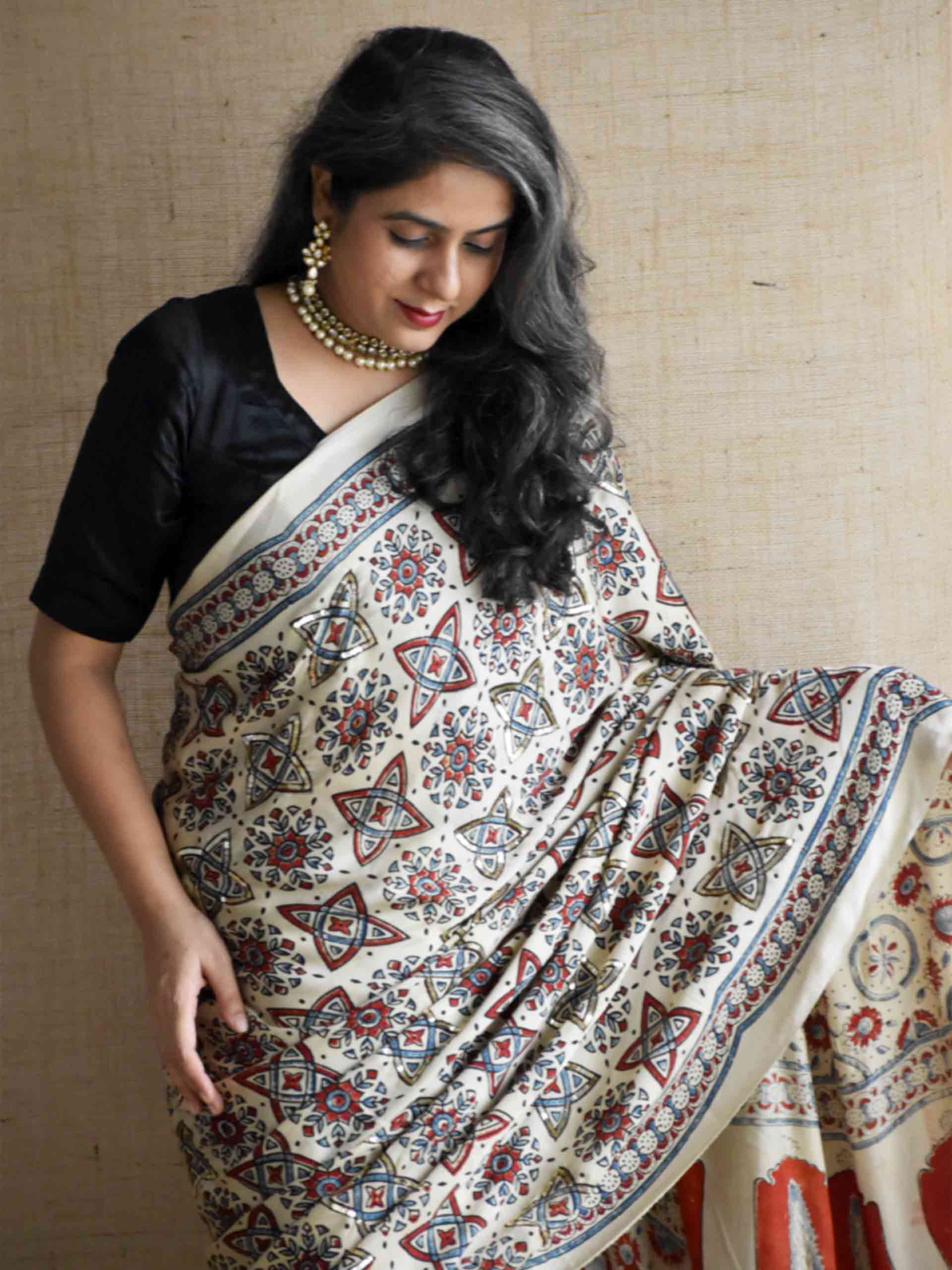 Subh-e-Nazneen - Ajrakh modal Silk hand embroidered Saree