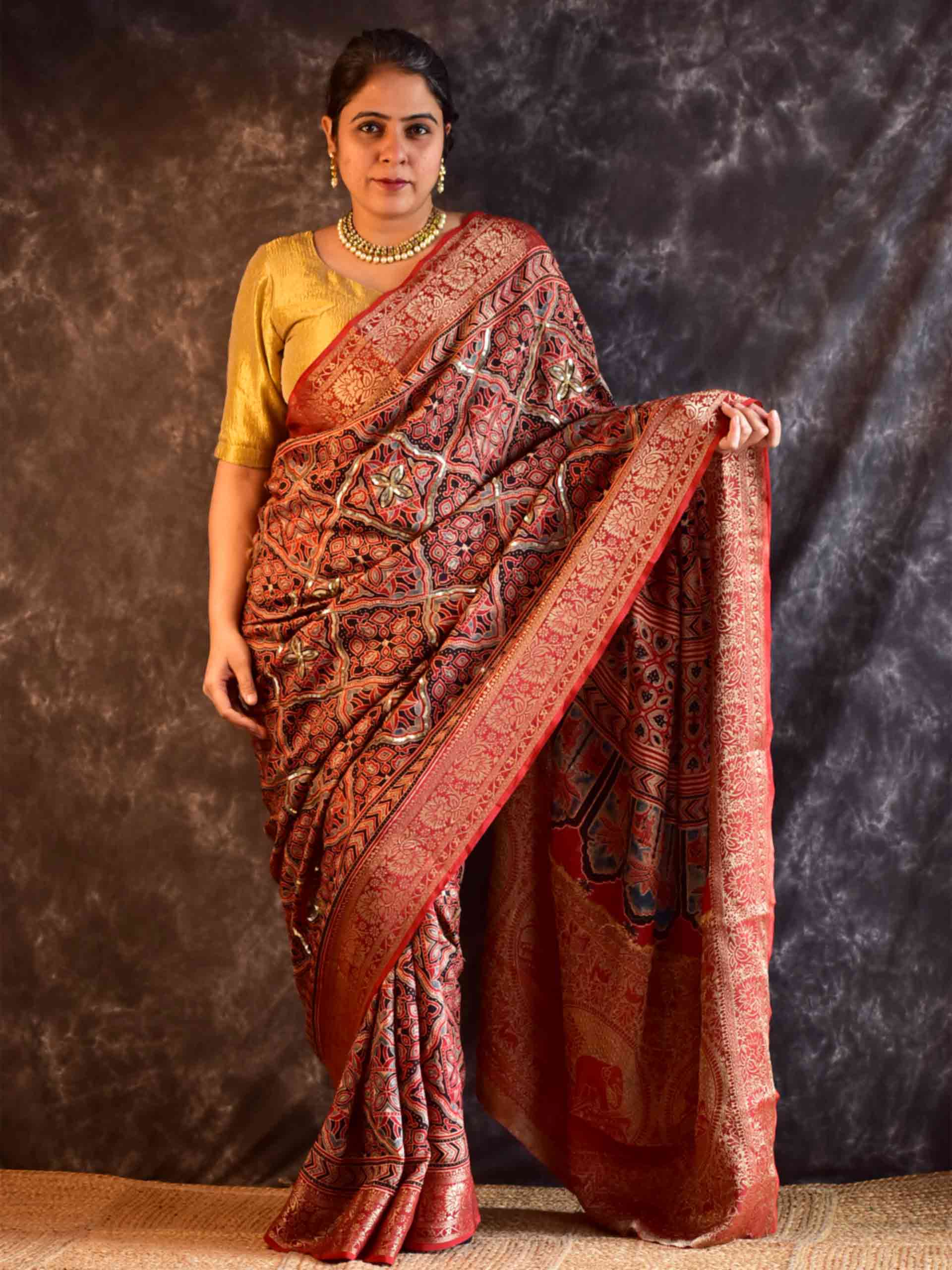 Gehrai - Ajrakh Dola Silk hand embroidered Saree