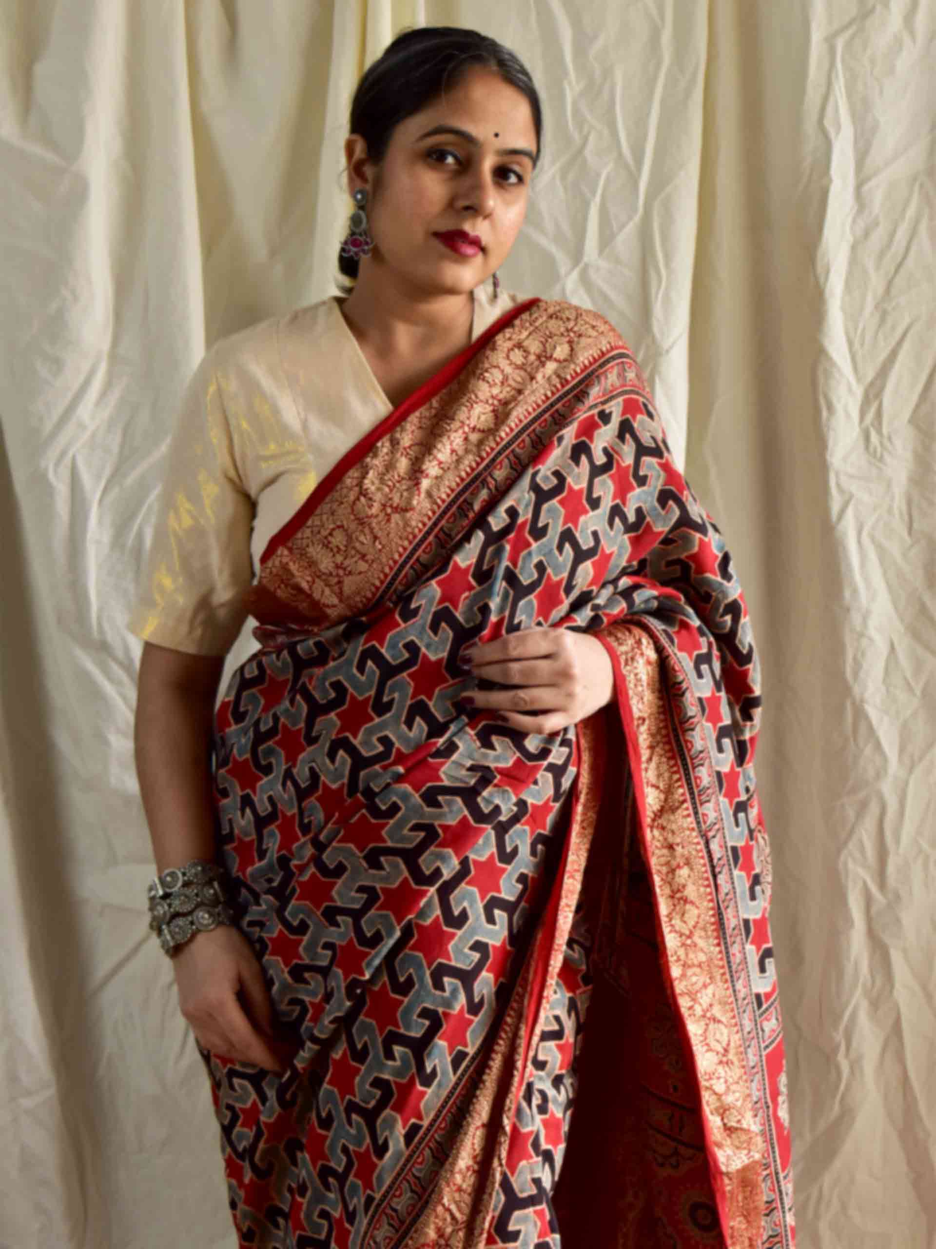 Shabnam - Ajrakh hand block printed Dola Silk zari border Saree