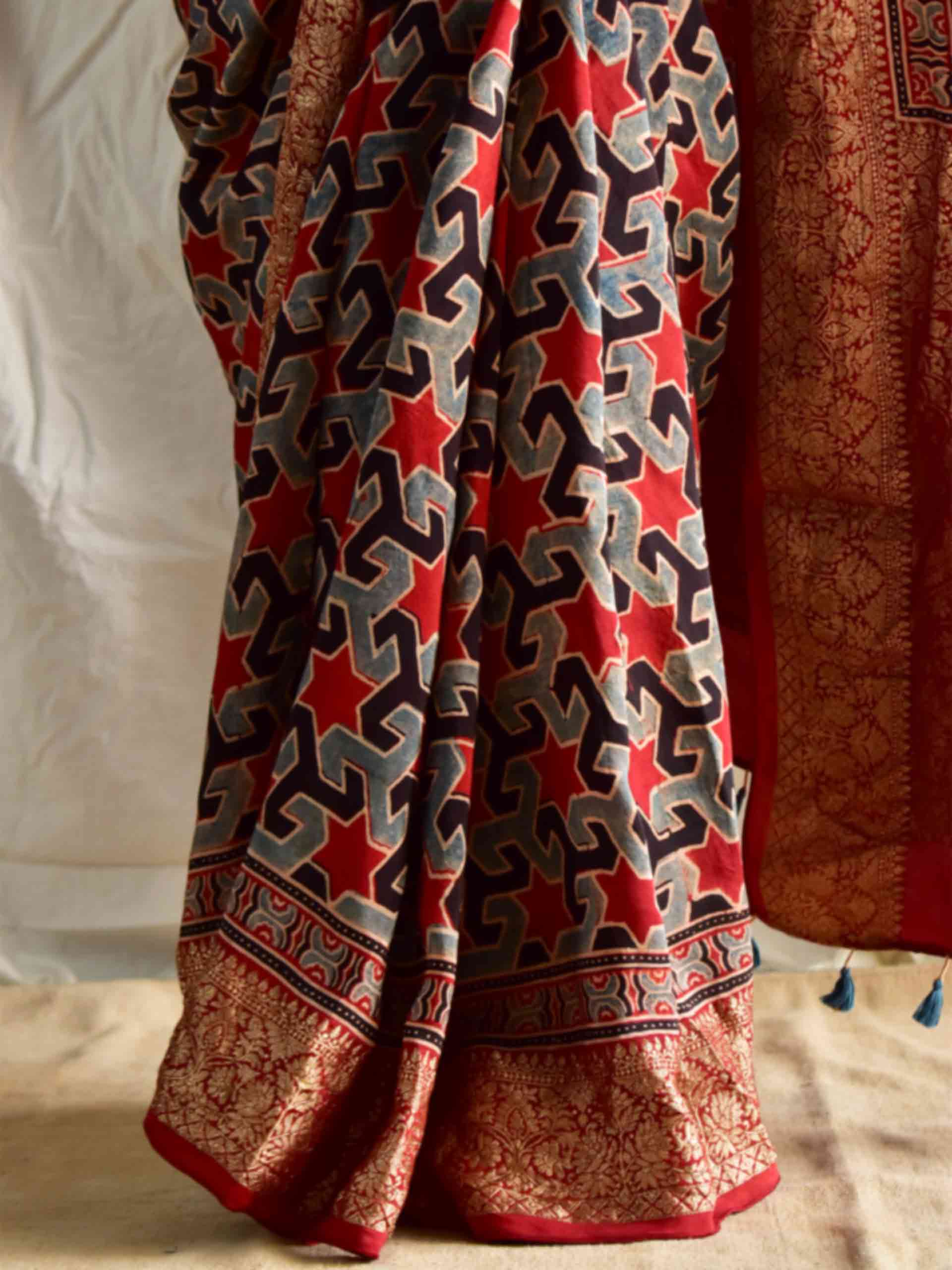 Shabnam - Ajrakh hand block printed Dola Silk zari border Saree