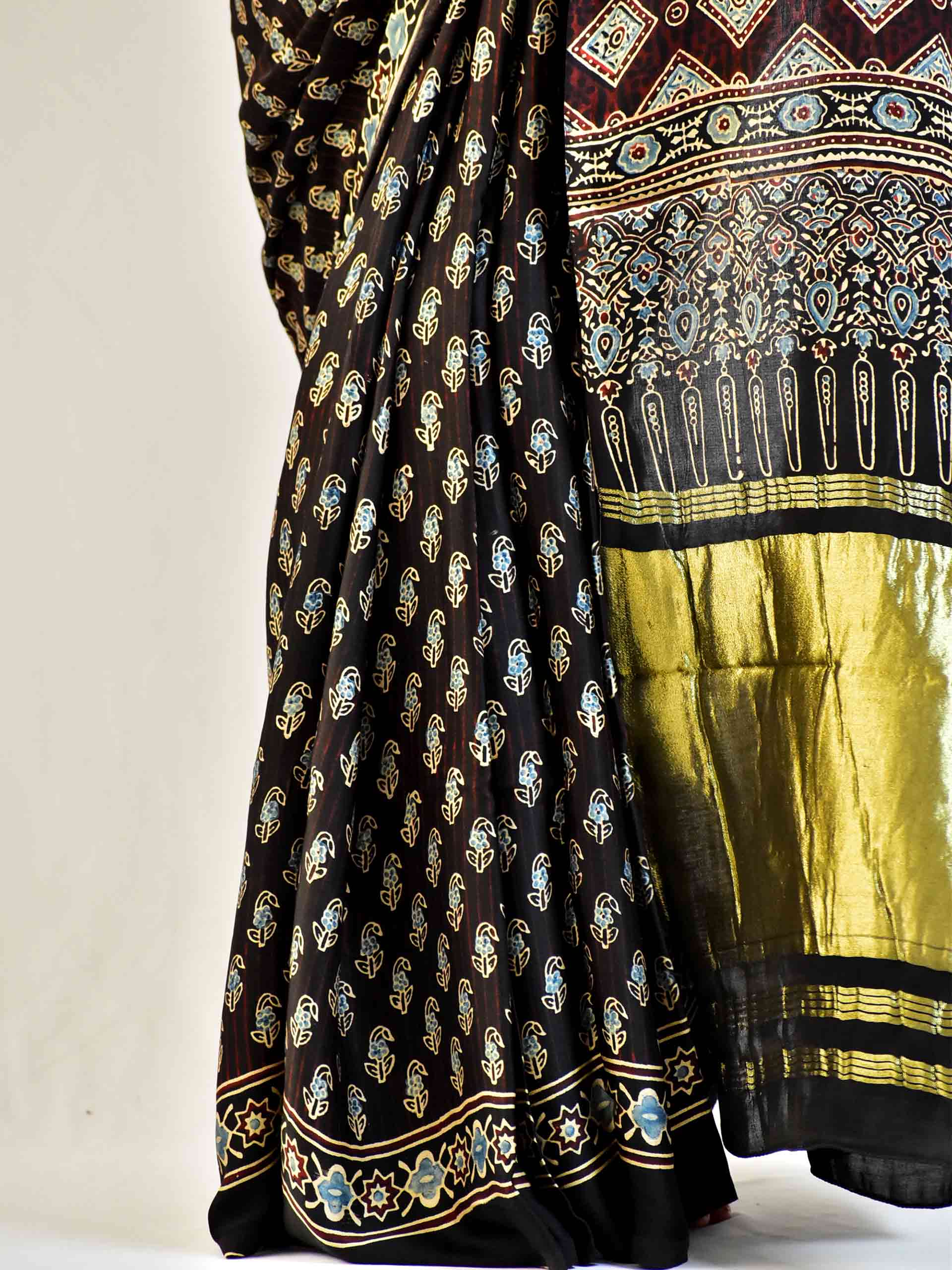 Firefly - Ajrakh hand block printed Modal Silk Saree with zari pallu