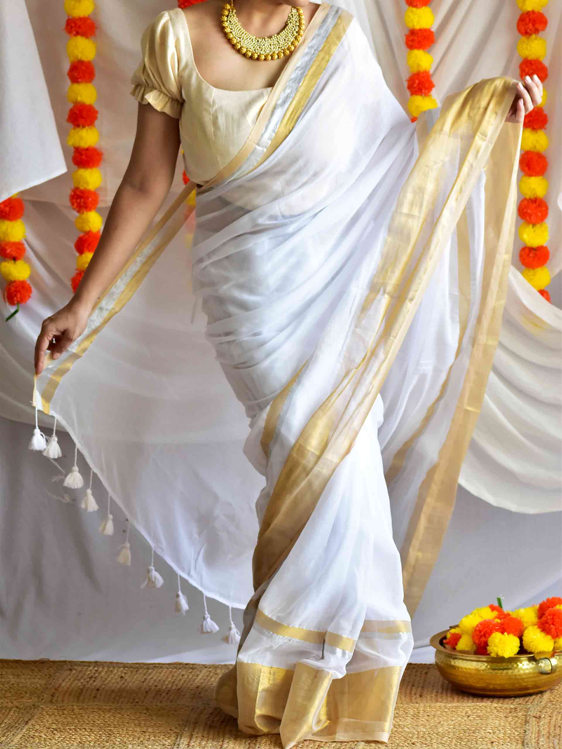 Onappovu - woven zari mul saree