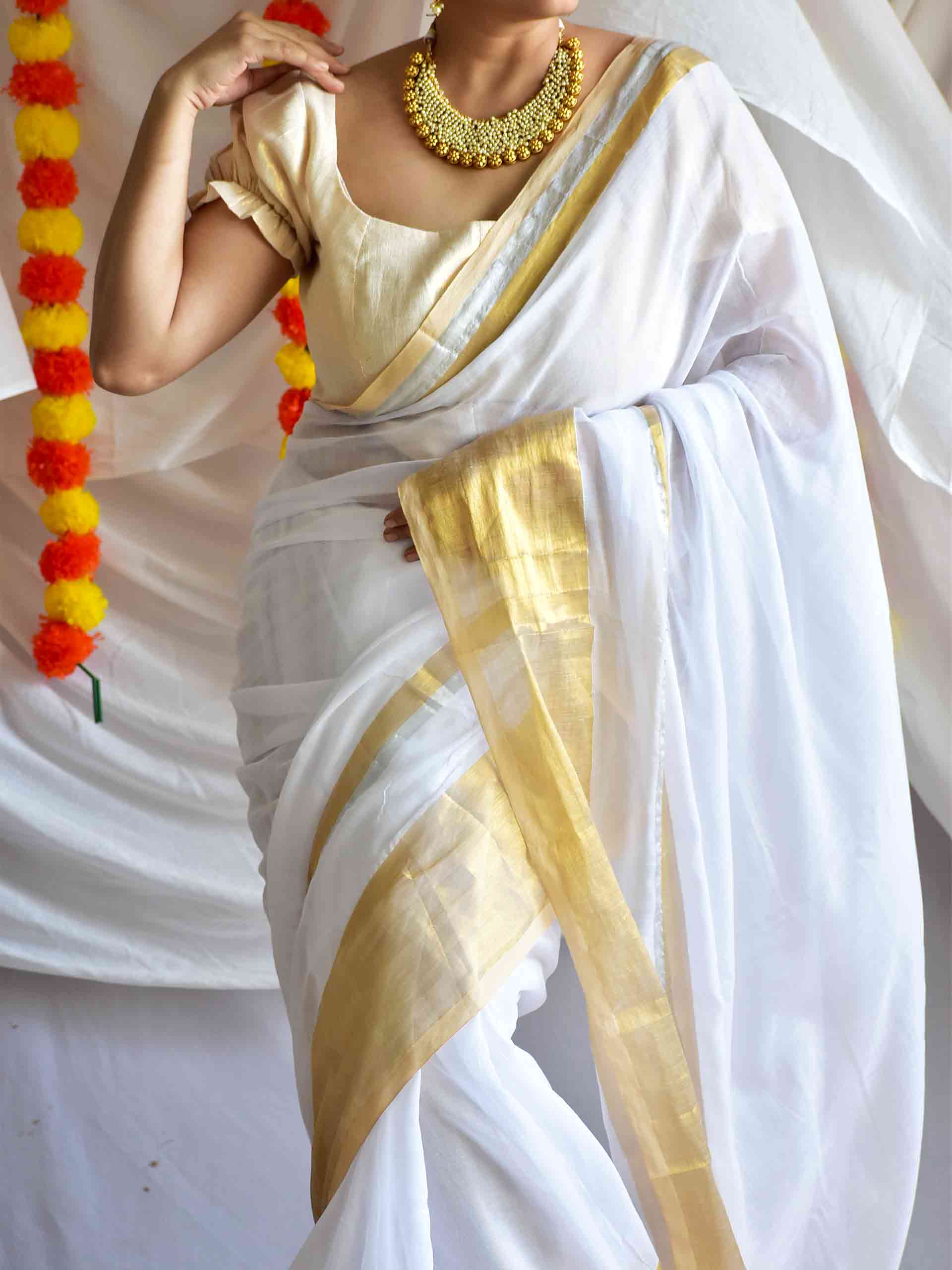 Onappovu - woven zari mul saree