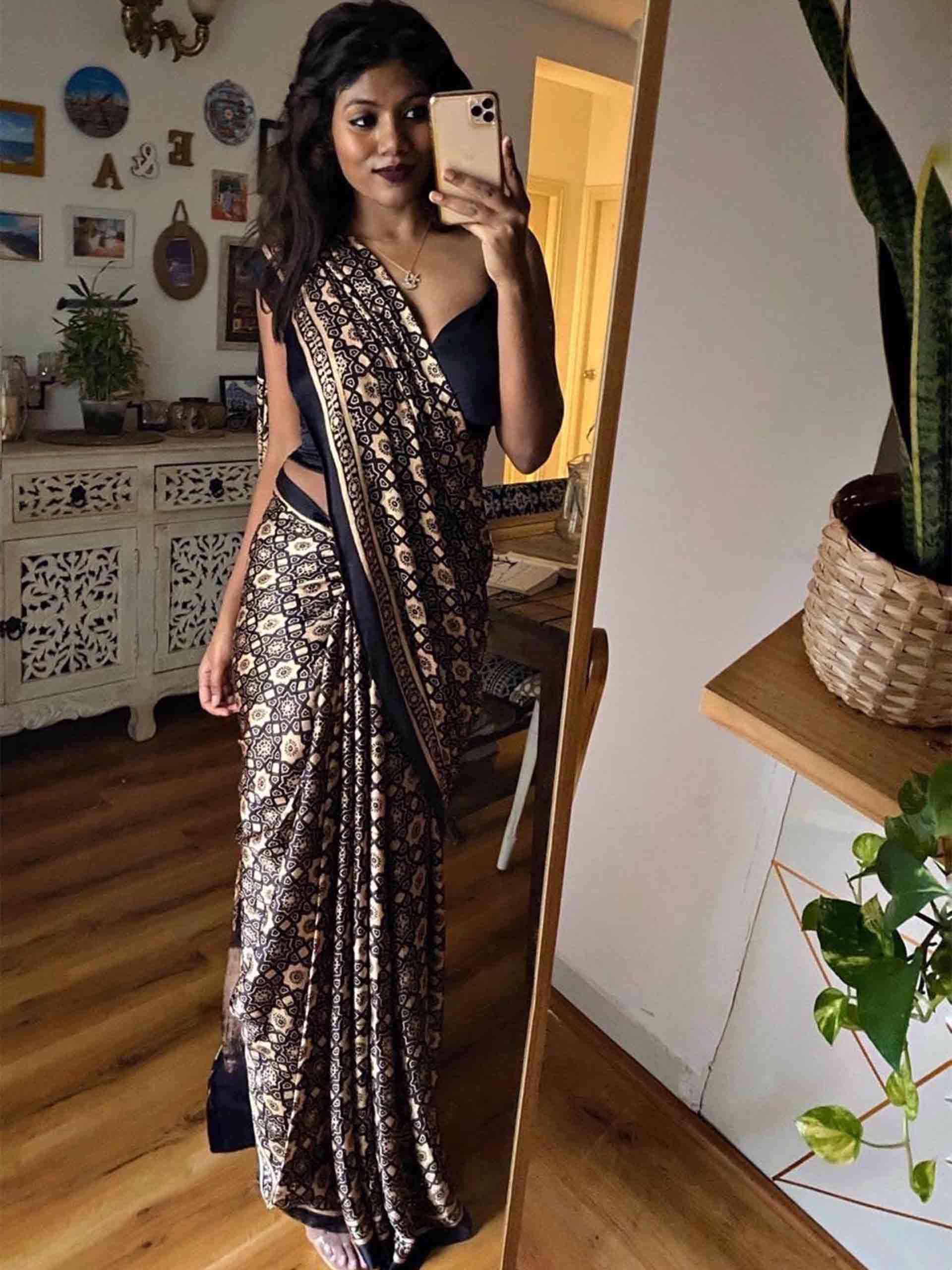 Black Eight Pointed Star Ajrakh Modal Silk Saree poses at home